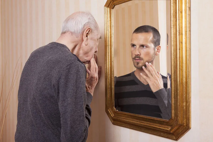 An image of man looking at his younger self to illustrate health secrets I wish I knew when I was 20